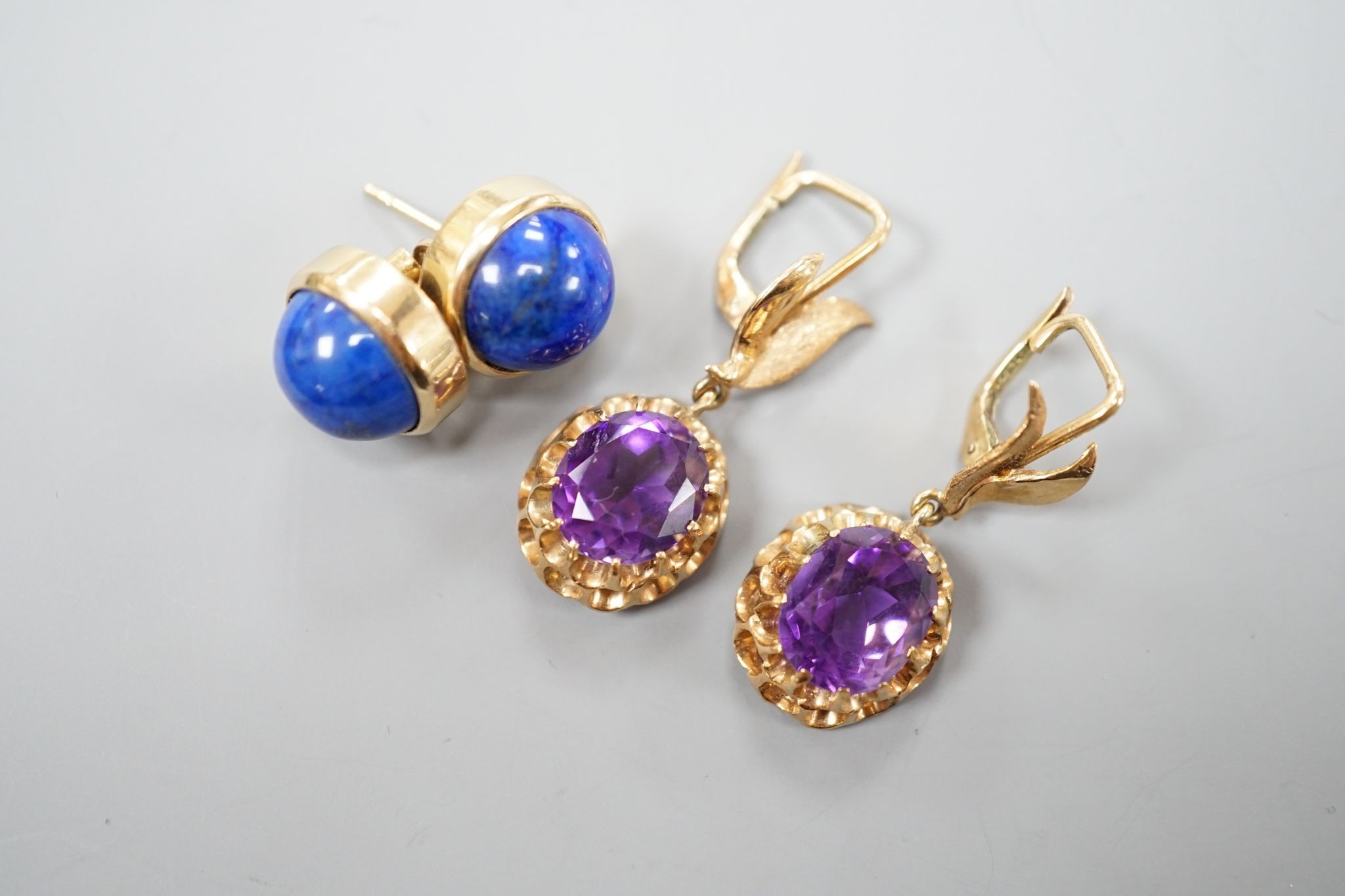 A modern pair of 14k yellow metal and amethyst set drop earrings, 29mm and a similar pair of lapis lazuli set earrings, gross weight 13.9 grams.